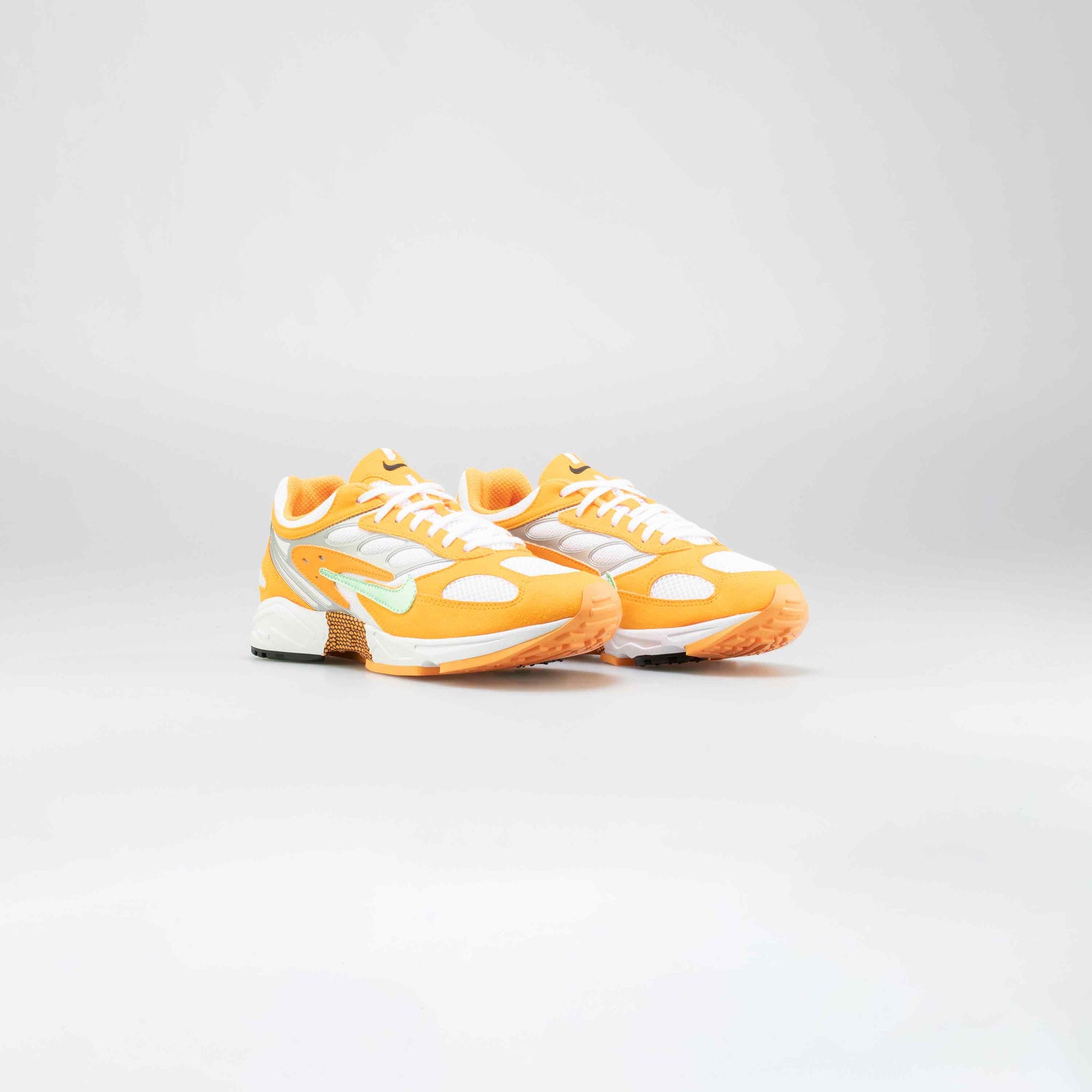 nike air ghost racer in orange peel
